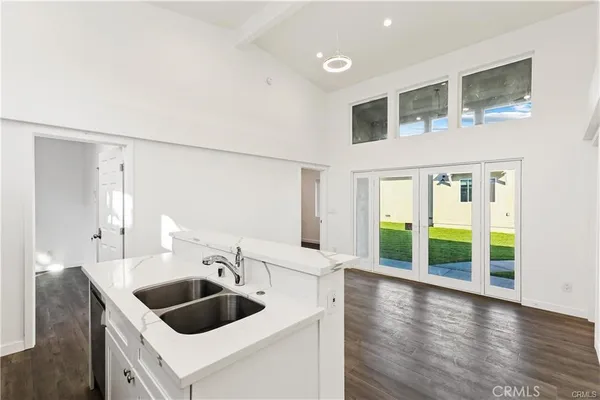 a kitchen with a sink and a large window