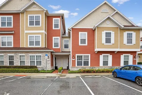 a front view of a residential apartment building with a street