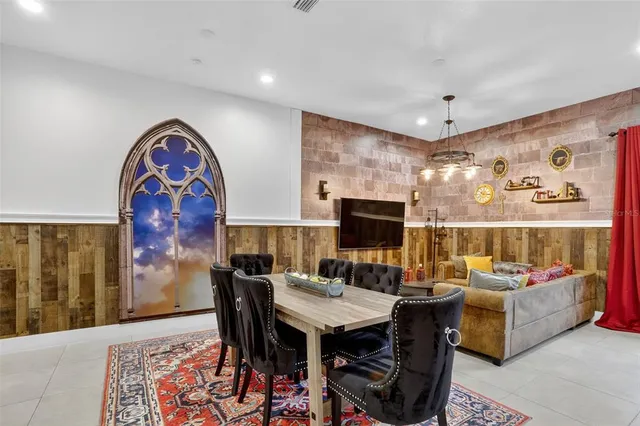 a living room with fireplace furniture and wooden floor