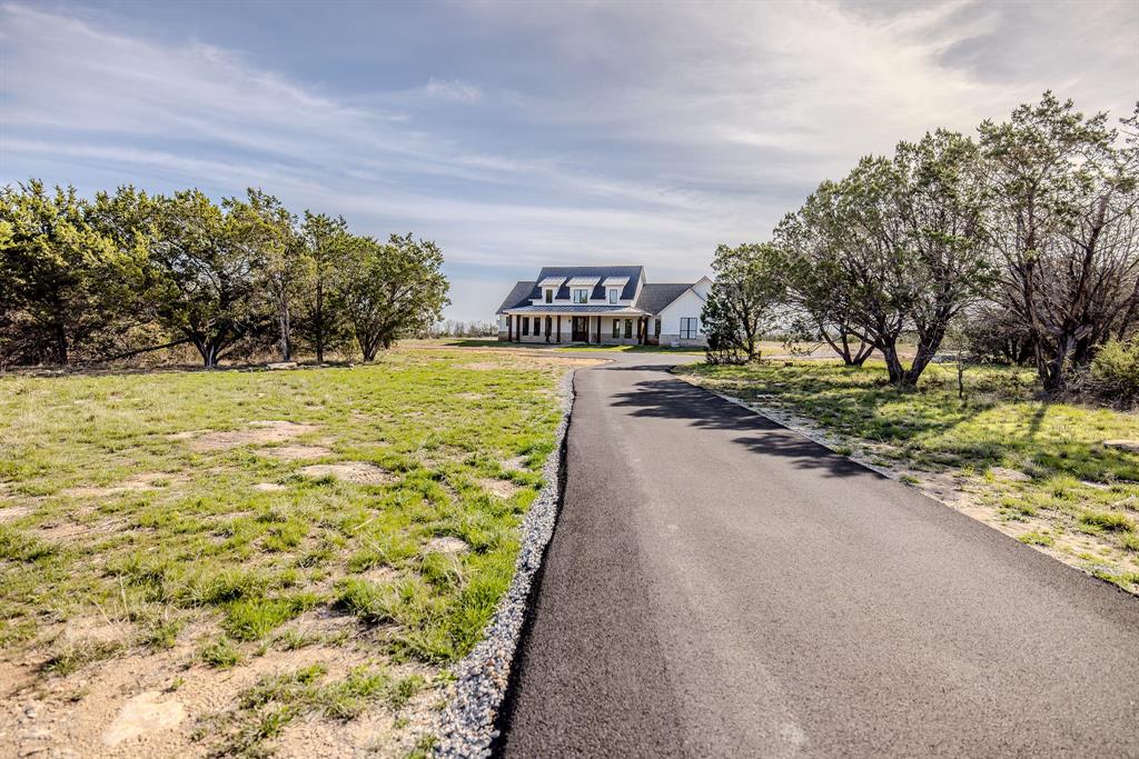 2847 Canyon Wren Loop Graford, TX 76449 - Photo 1 of 40 a view of a yard with an trees