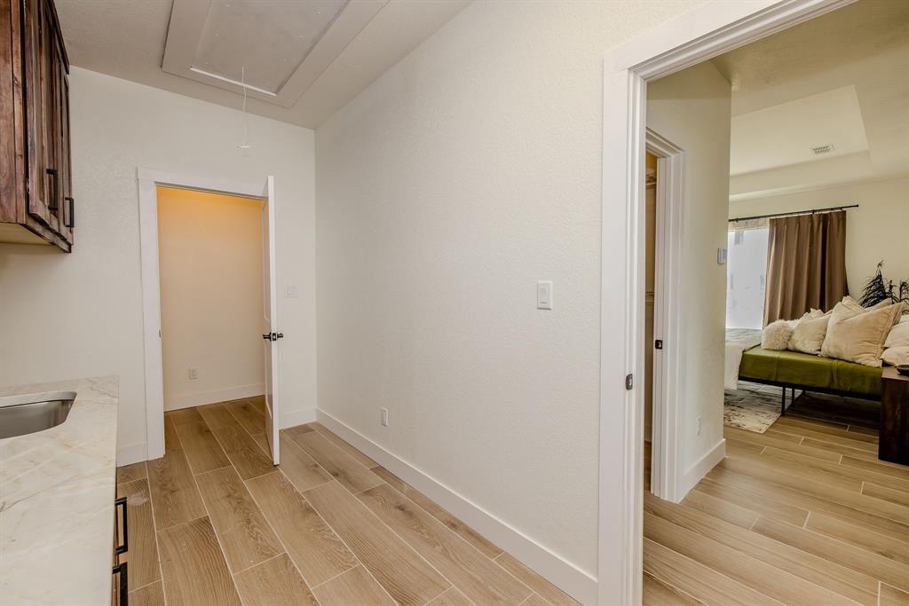 2847 Canyon Wren Loop Graford, TX 76449 - Photo 27 of 40 a view of a bedroom from a hallway