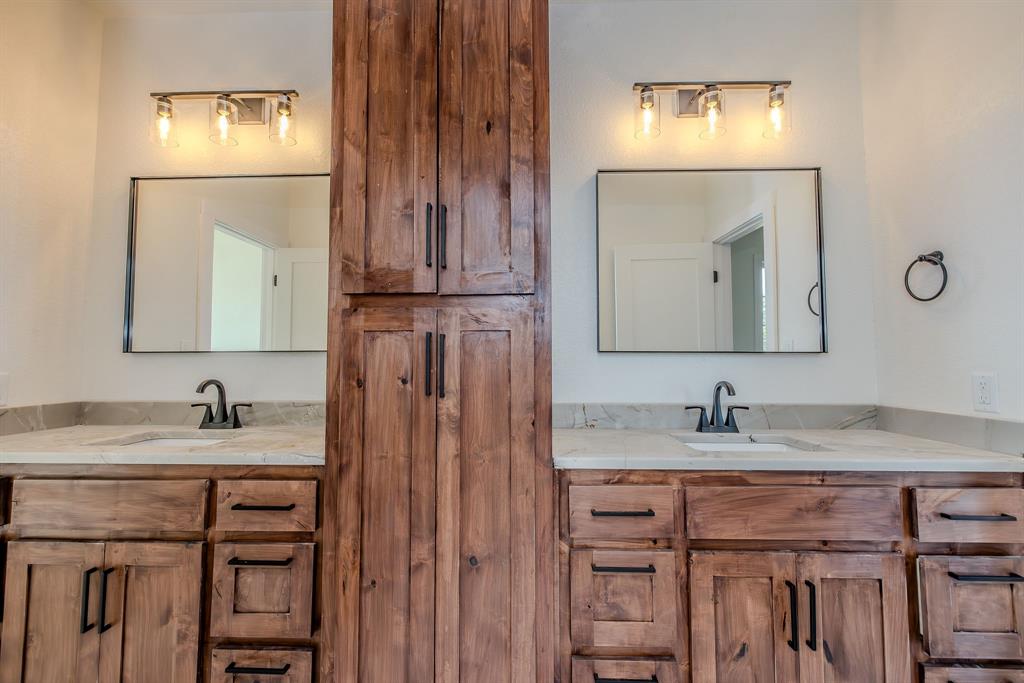 2847 Canyon Wren Loop Graford, TX 76449 - Photo 31 of 40 a bathroom with a sink vanity and a mirror