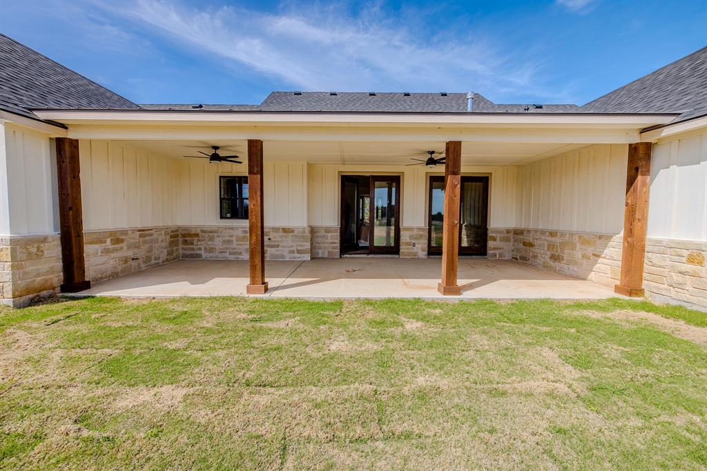 2847 Canyon Wren Loop Graford, TX 76449 - Photo 38 of 40 a view of a porch with a table and chairs