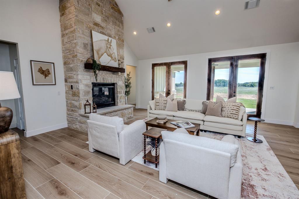 2847 Canyon Wren Loop Graford, TX 76449 - Photo 6 of 40 a living room with furniture and a fireplace