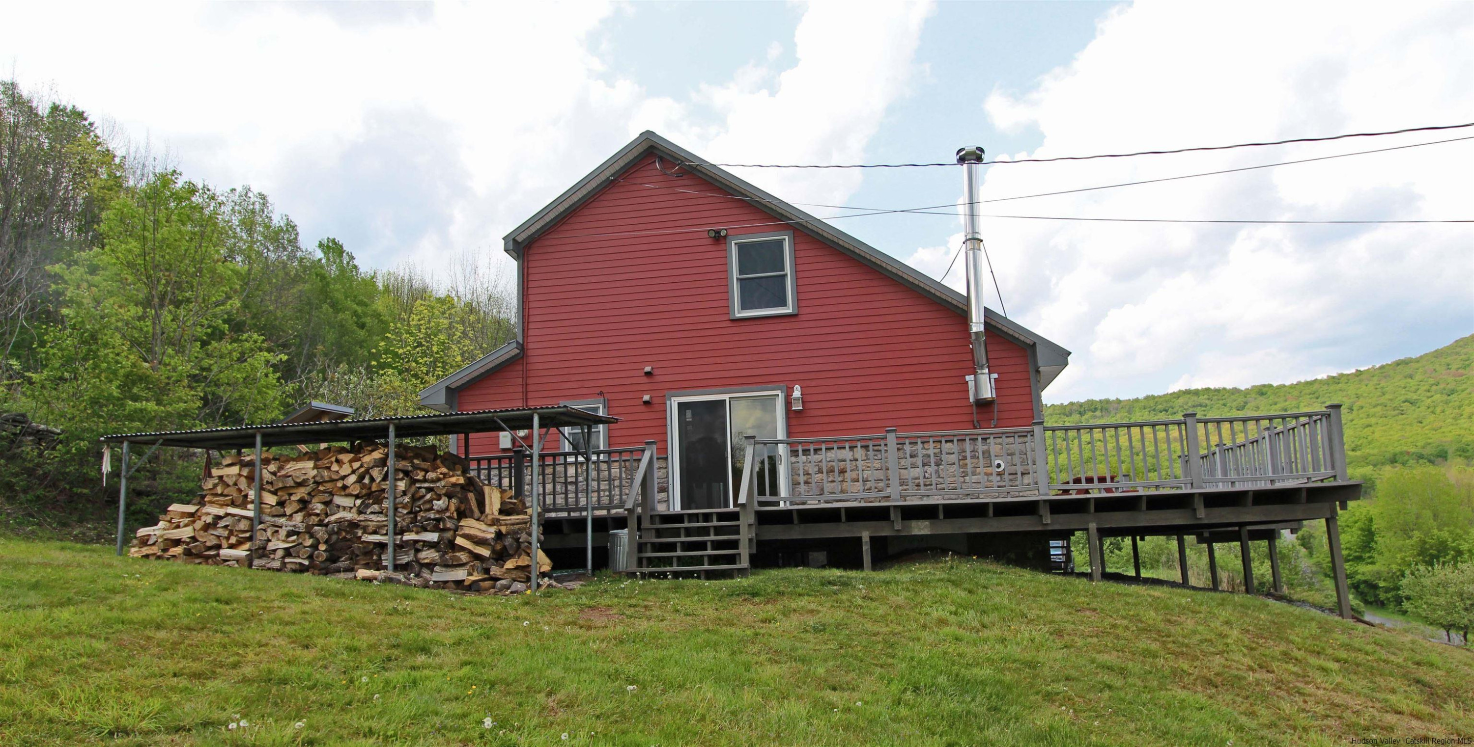 143 Rossman Road Roxbury, NY 12421 - Photo 13 of 35 a view of a house with a yard and sitting area