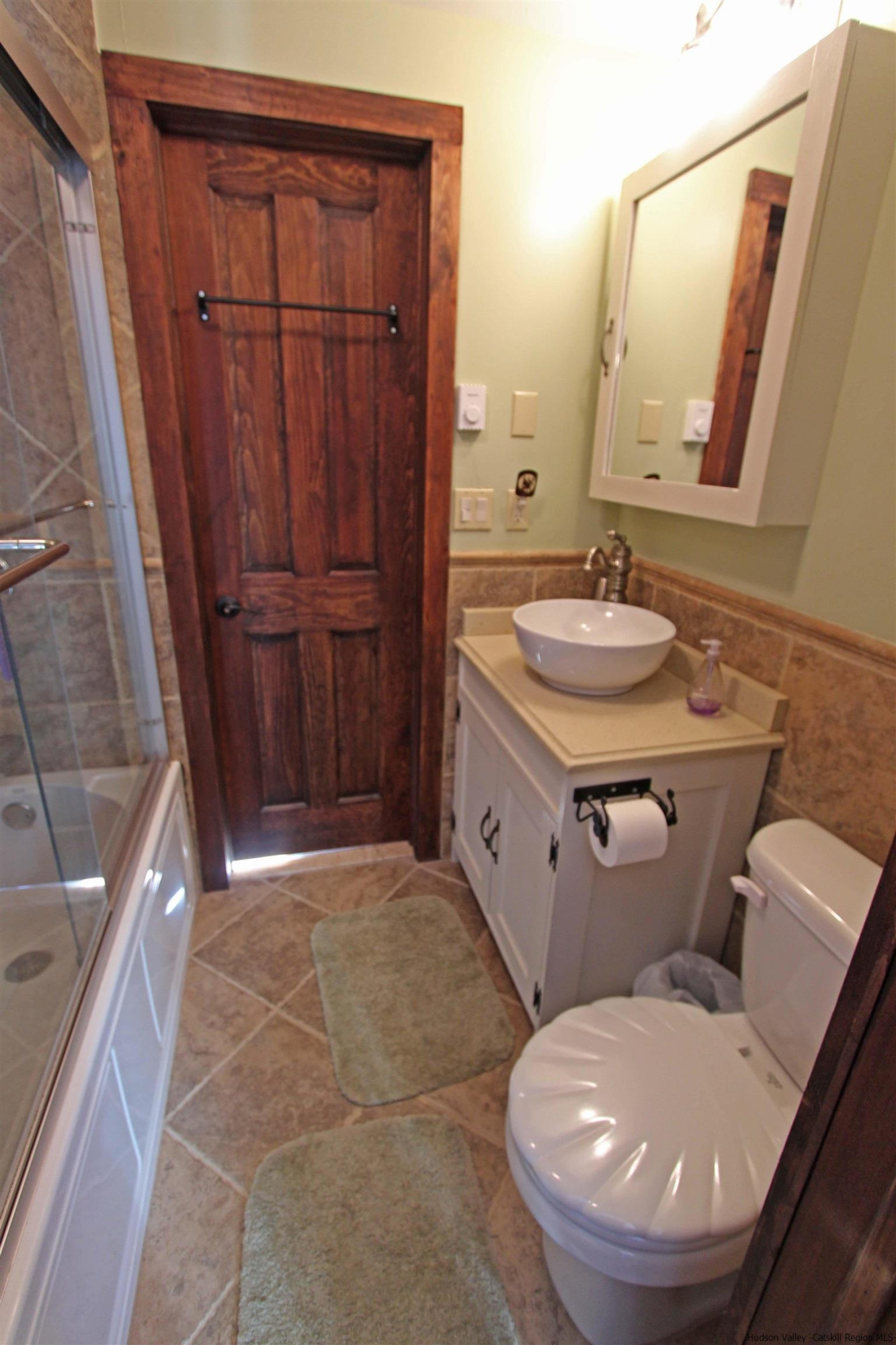 143 Rossman Road Roxbury, NY 12421 - Photo 29 of 35 a bathroom with a granite countertop sink a mirror and a toilet