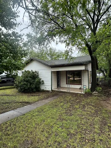 a house with trees in the background