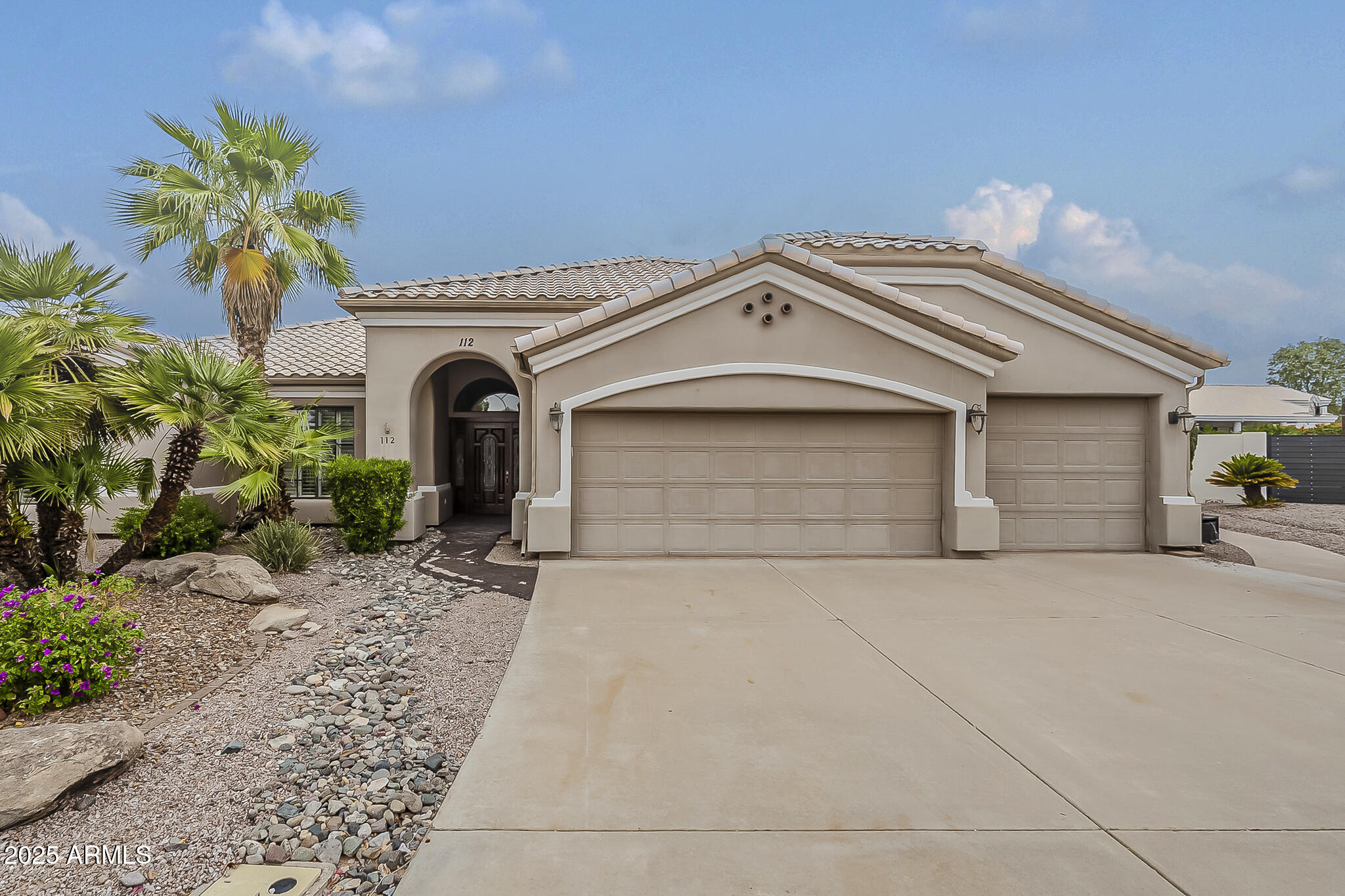 5345 East McLellan Road, Unit 112 Mesa, AZ 85205 - Photo 1 of 74 a front view of a house with a garage