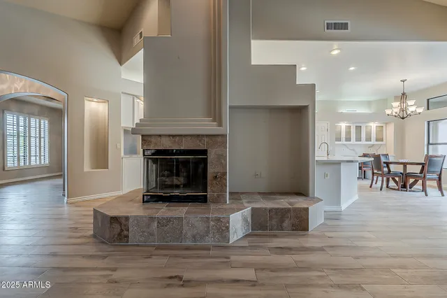 a living room with furniture and a fireplace