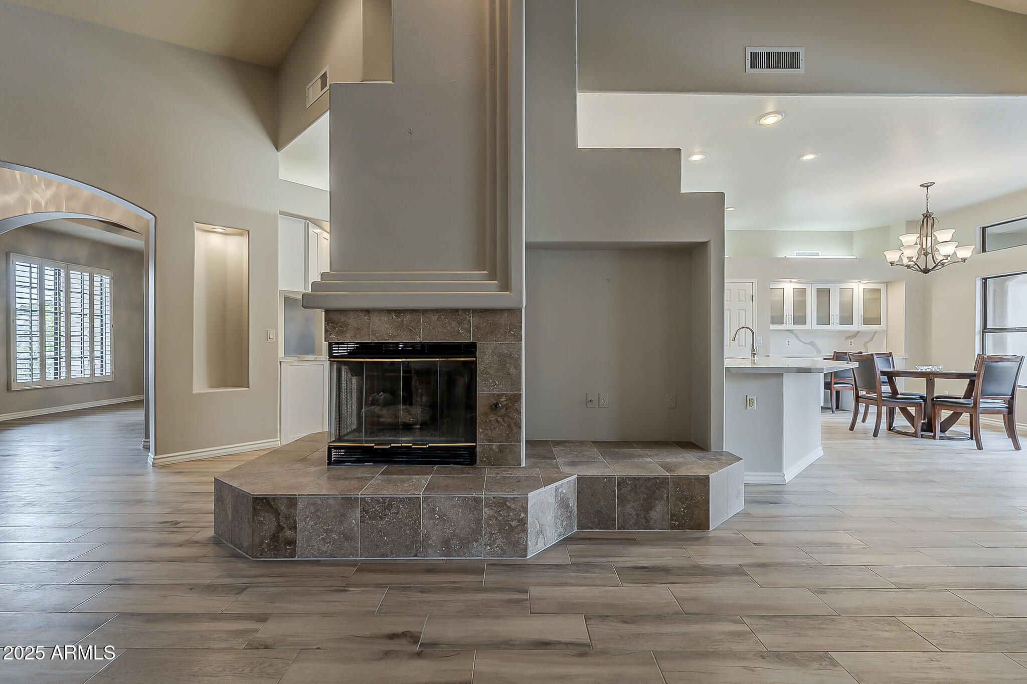 5345 East McLellan Road, Unit 112 Mesa, AZ 85205 - Photo 11 of 74 a living room with furniture and a fireplace