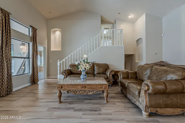 a living room with furniture and a table