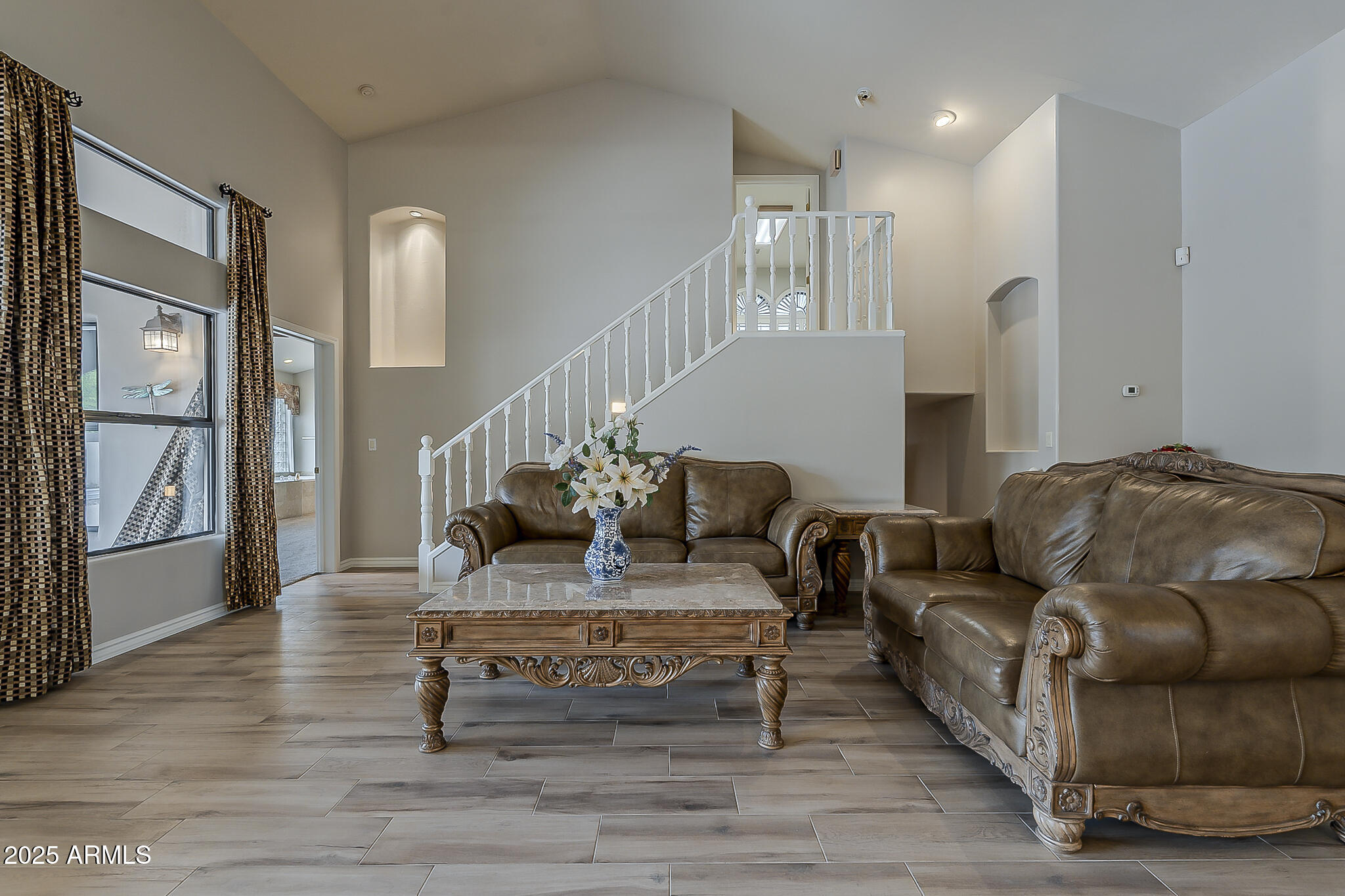 5345 East McLellan Road, Unit 112 Mesa, AZ 85205 - Photo 12 of 74 a living room with furniture and a table