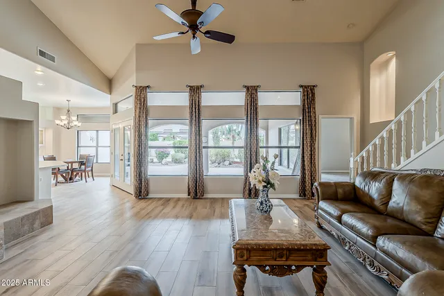 a living room with furniture and a large window