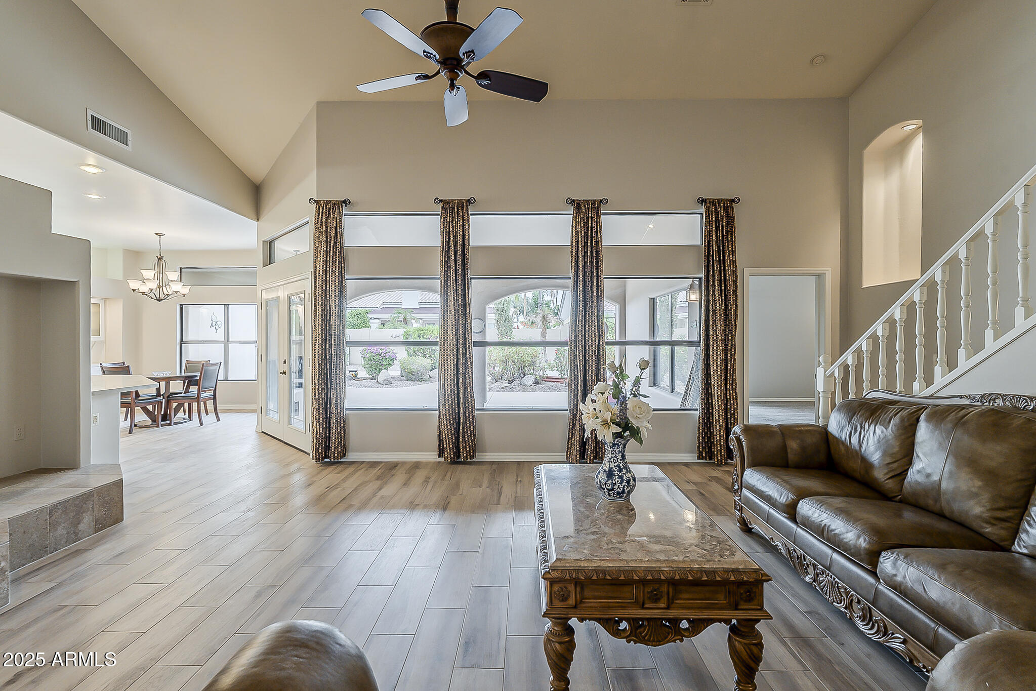 5345 East McLellan Road, Unit 112 Mesa, AZ 85205 - Photo 13 of 74 a living room with furniture and a large window