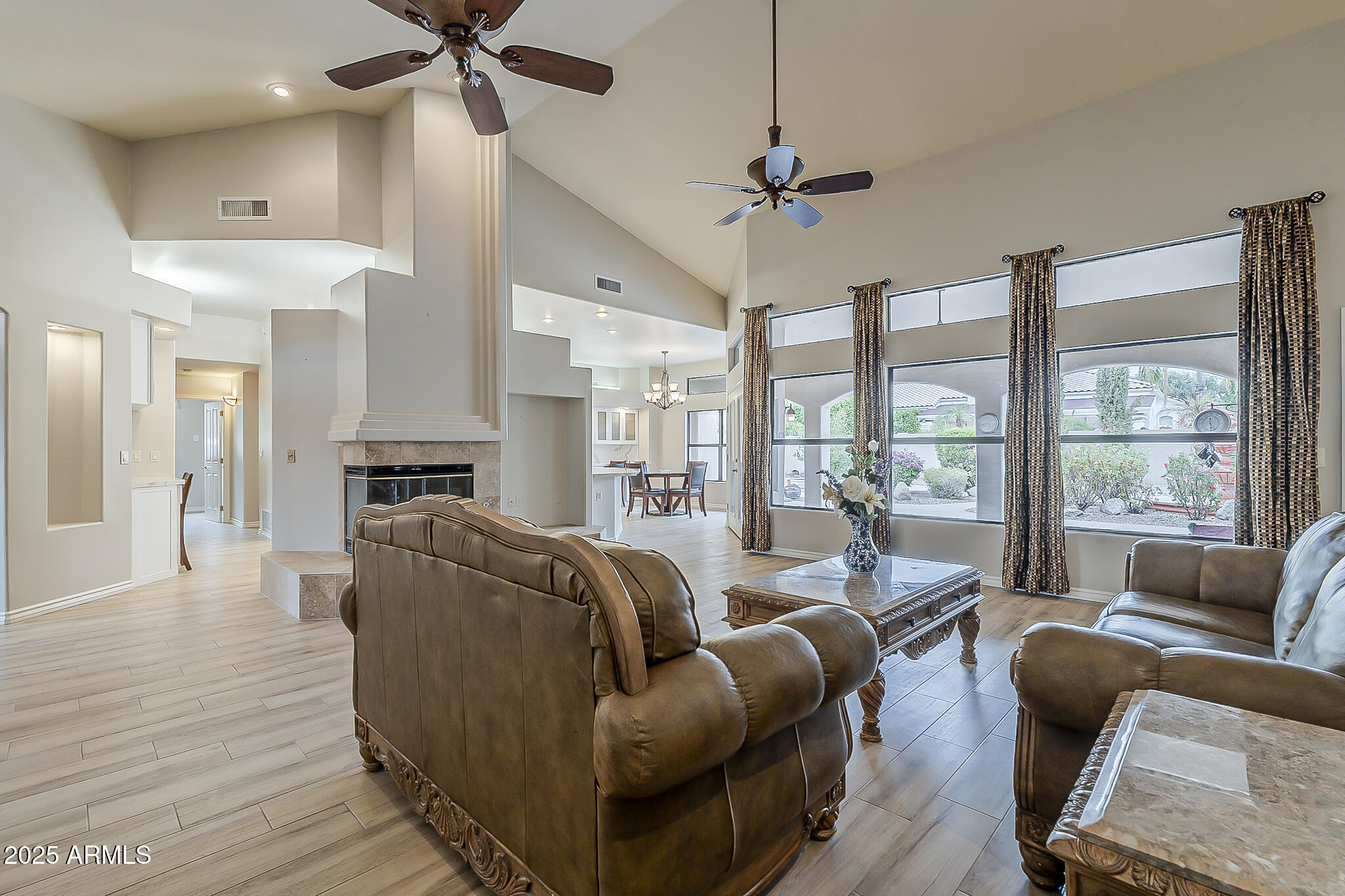 5345 East McLellan Road, Unit 112 Mesa, AZ 85205 - Photo 14 of 74 a living room with furniture and a large window