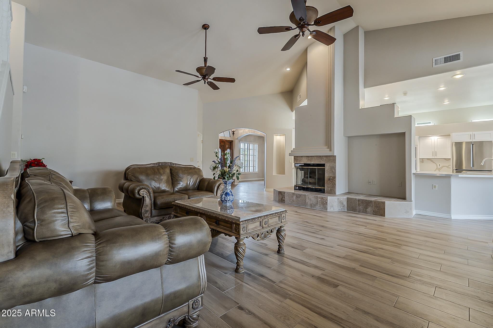 5345 East McLellan Road, Unit 112 Mesa, AZ 85205 - Photo 16 of 74 a view of a livingroom with furniture and a ceiling fan