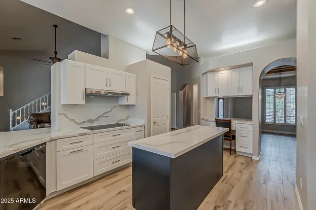 a kitchen with stainless steel appliances a stove and a refrigerator