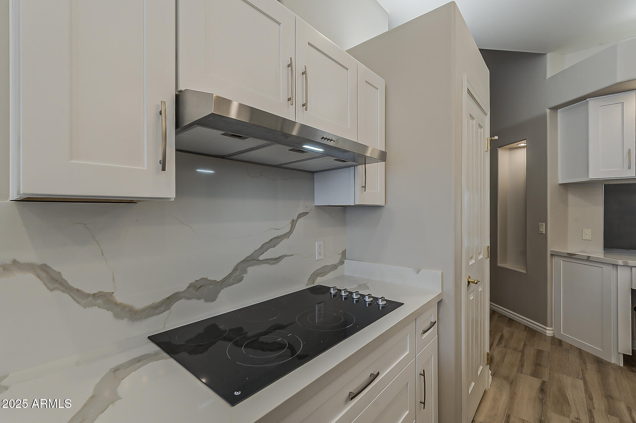 5345 East McLellan Road, Unit 112 Mesa, AZ 85205 - Photo 28 of 74 a kitchen with stainless steel appliances a stove and a refrigerator