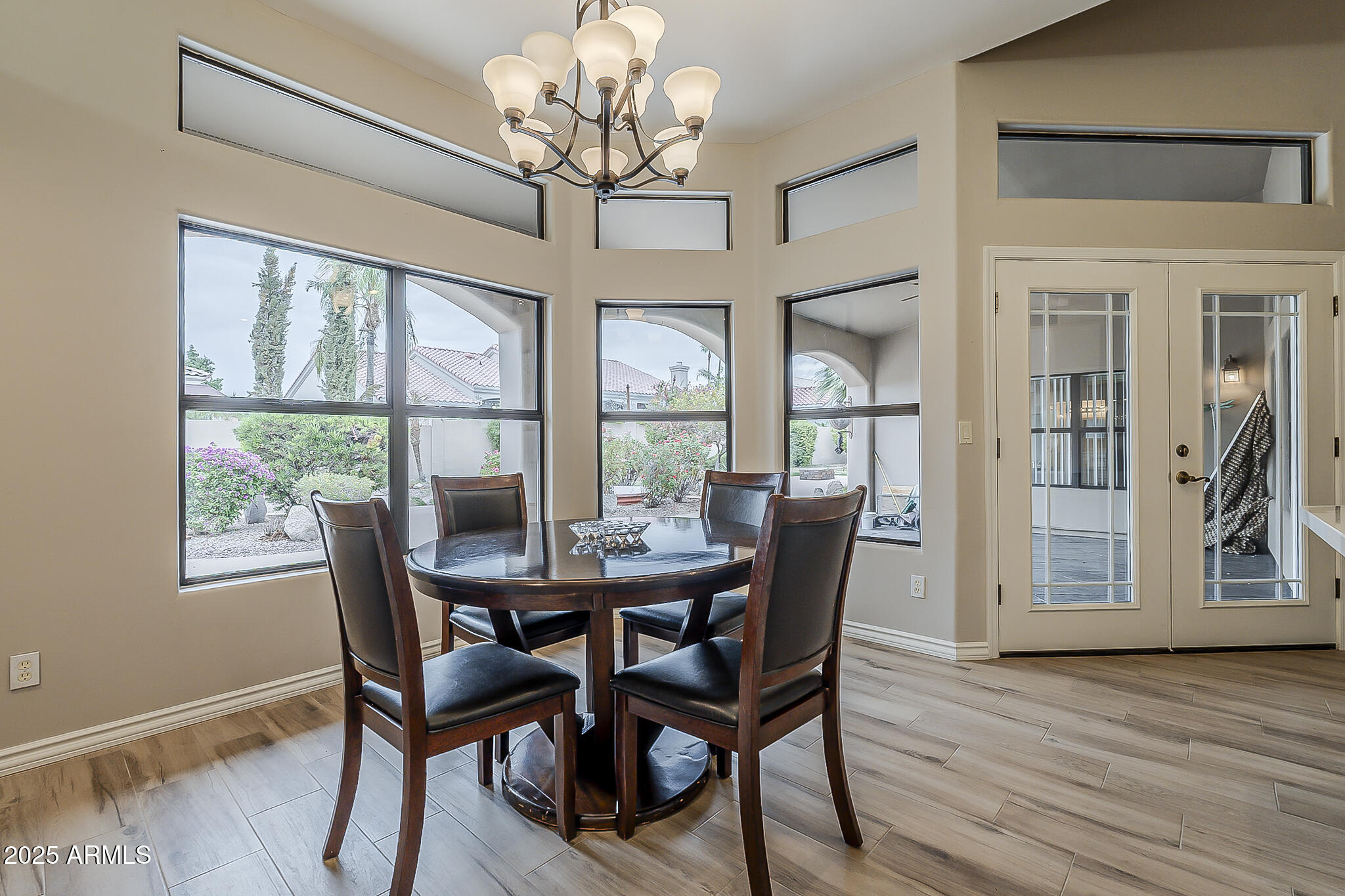 5345 East McLellan Road, Unit 112 Mesa, AZ 85205 - Photo 29 of 74 a view of a dining room with furniture window and wooden floor