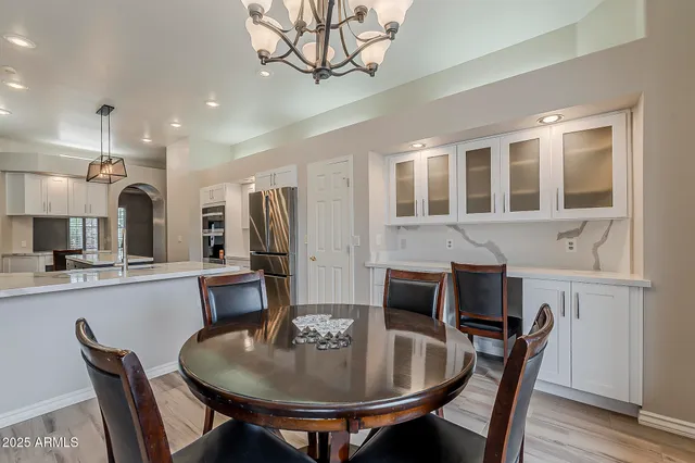 a bathroom with a shower sink and mirror