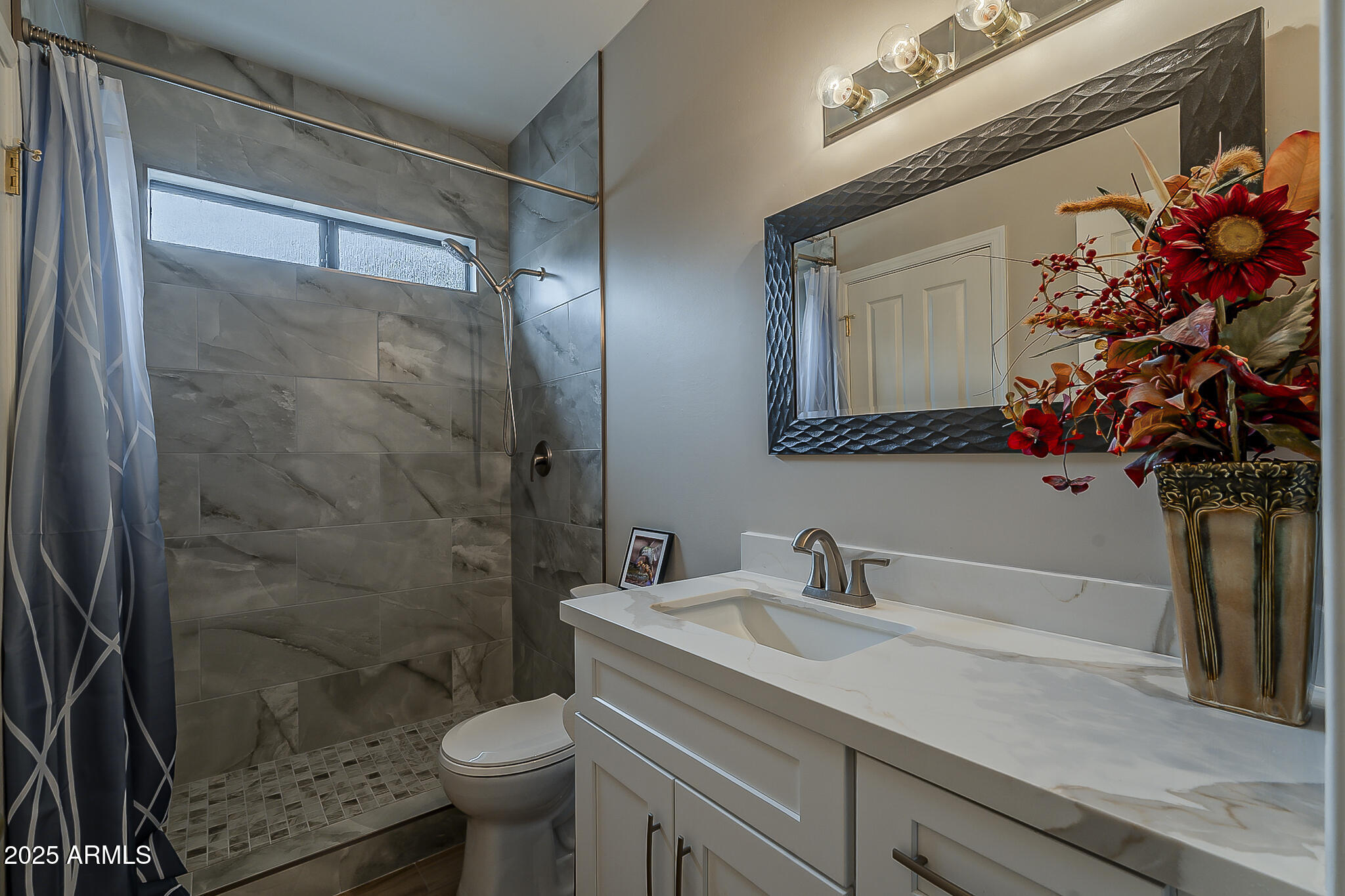 5345 East McLellan Road, Unit 112 Mesa, AZ 85205 - Photo 36 of 74 a bathroom with a sink toilet and shower