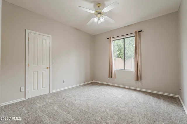 a view of an empty room and stairs