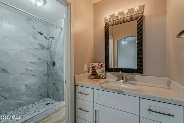 a view of an empty room with a fireplace and a window
