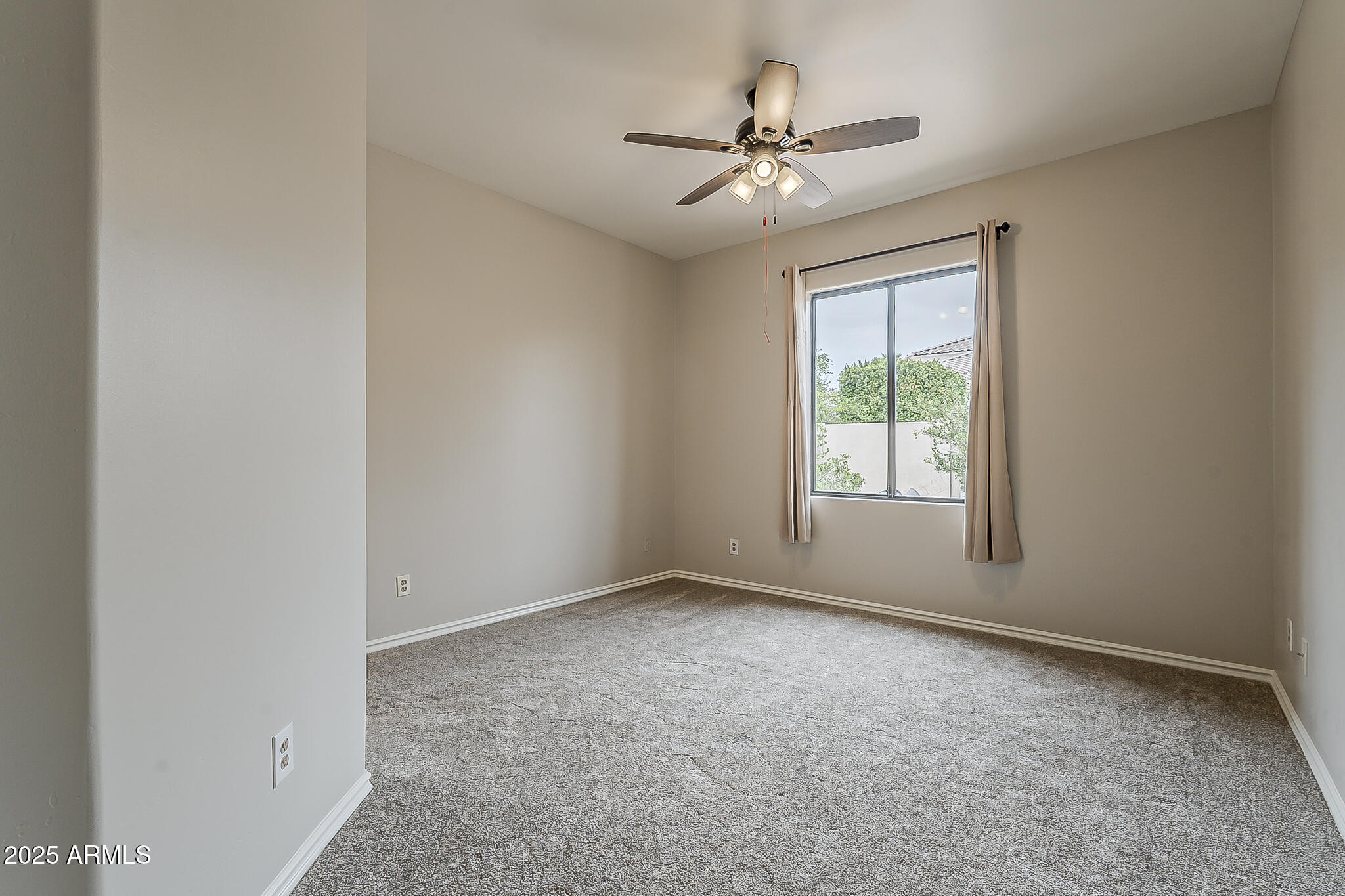 5345 East McLellan Road, Unit 112 Mesa, AZ 85205 - Photo 42 of 74 an empty room with windows and fan