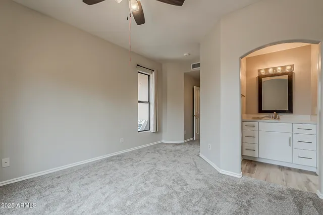 a view of bath tub sitting in a bathroom next to a window