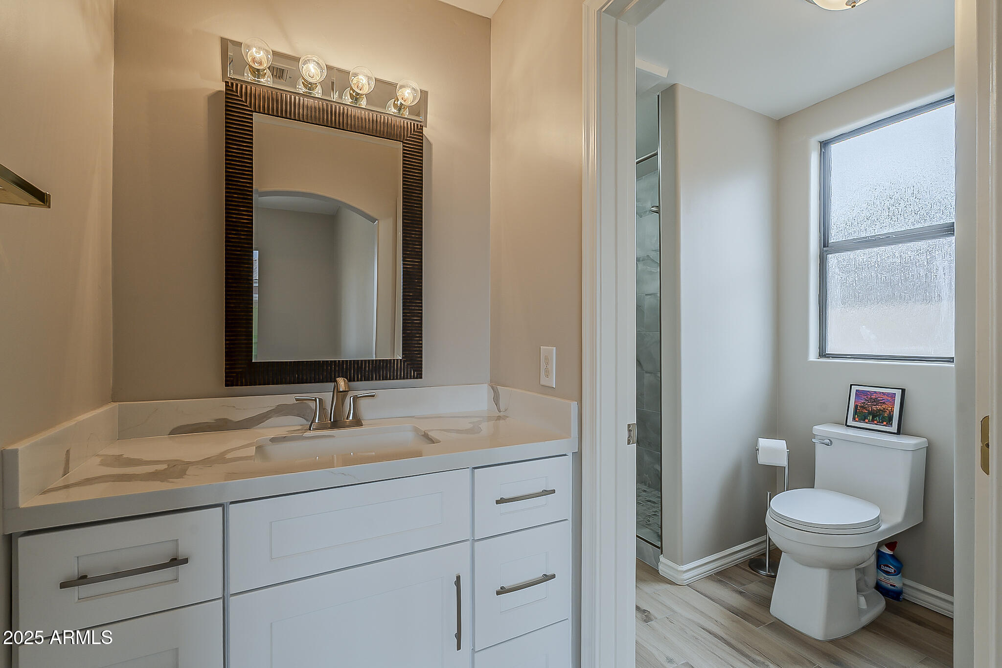 5345 East McLellan Road, Unit 112 Mesa, AZ 85205 - Photo 45 of 74 a bathroom with a toilet sink and mirror