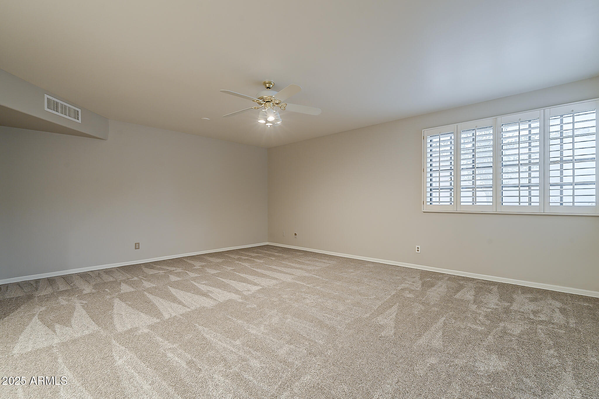 5345 East McLellan Road, Unit 112 Mesa, AZ 85205 - Photo 46 of 74 a view of an empty room with a window