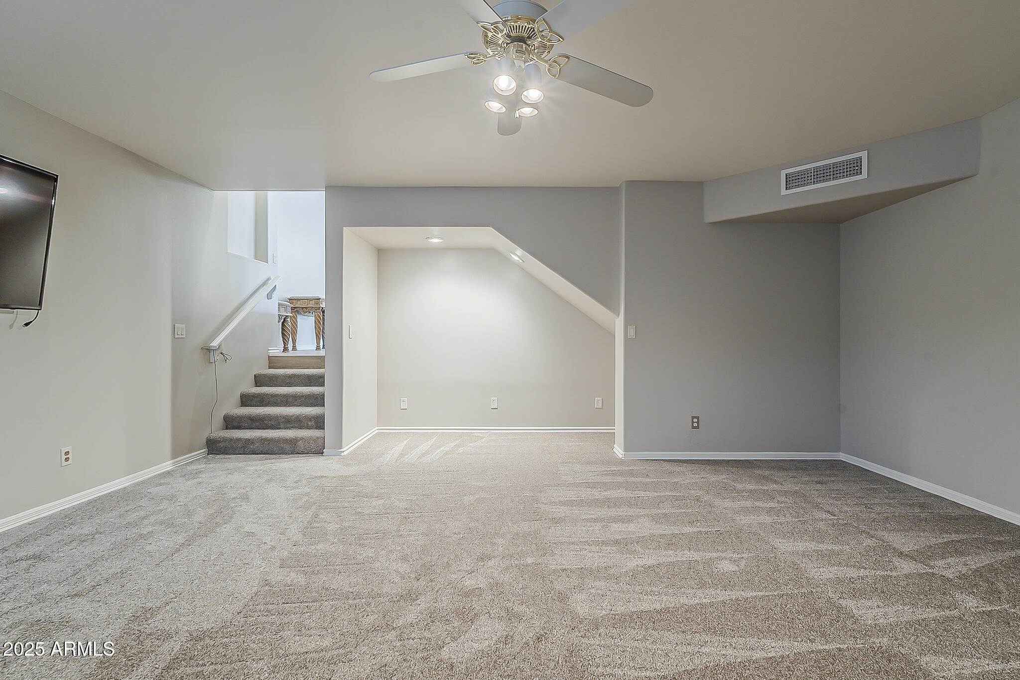 5345 East McLellan Road, Unit 112 Mesa, AZ 85205 - Photo 50 of 74 a view of an empty room and stairs