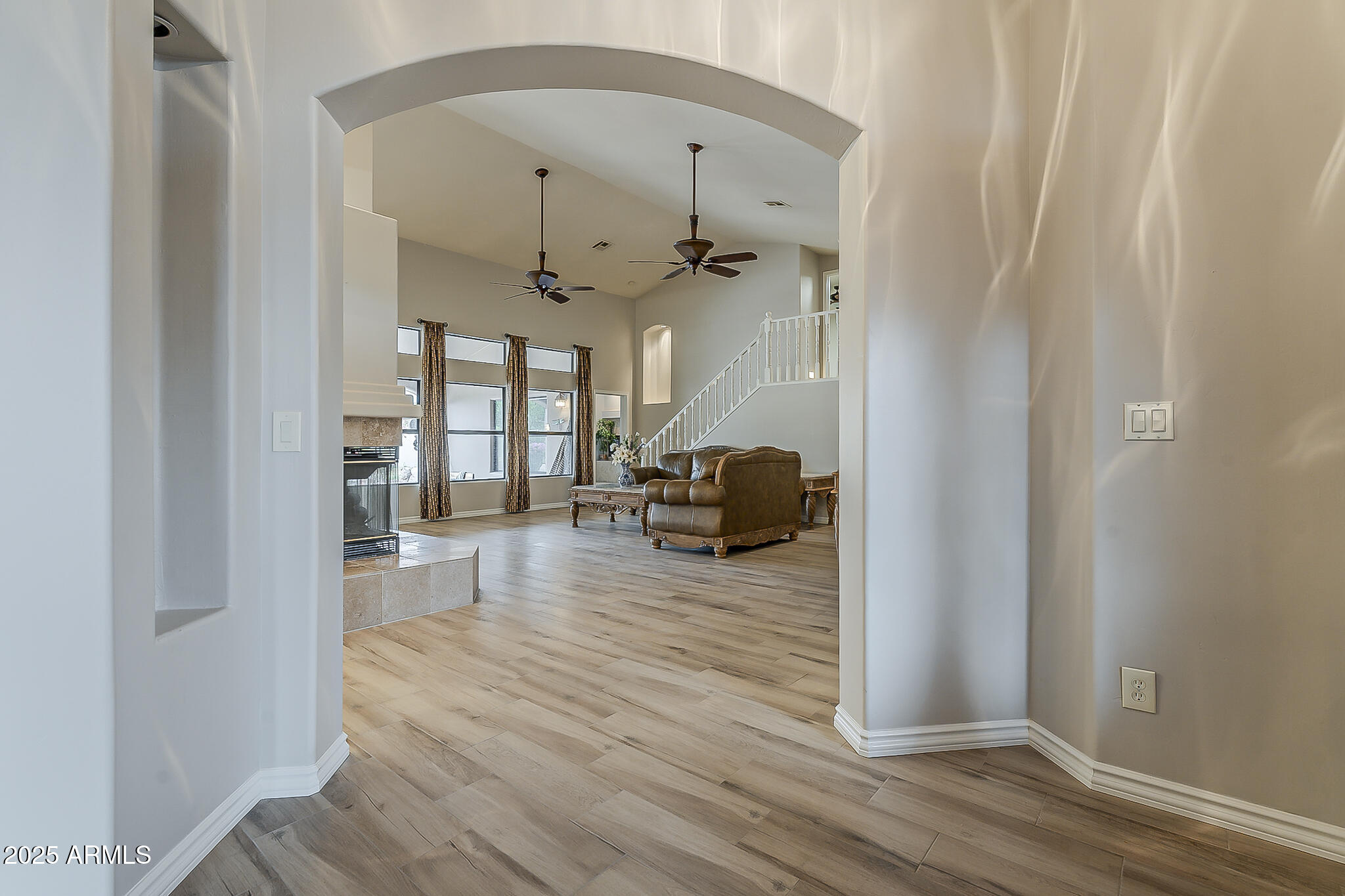 5345 East McLellan Road, Unit 112 Mesa, AZ 85205 - Photo 5 of 74 a view of a livingroom with wooden floor and furniture