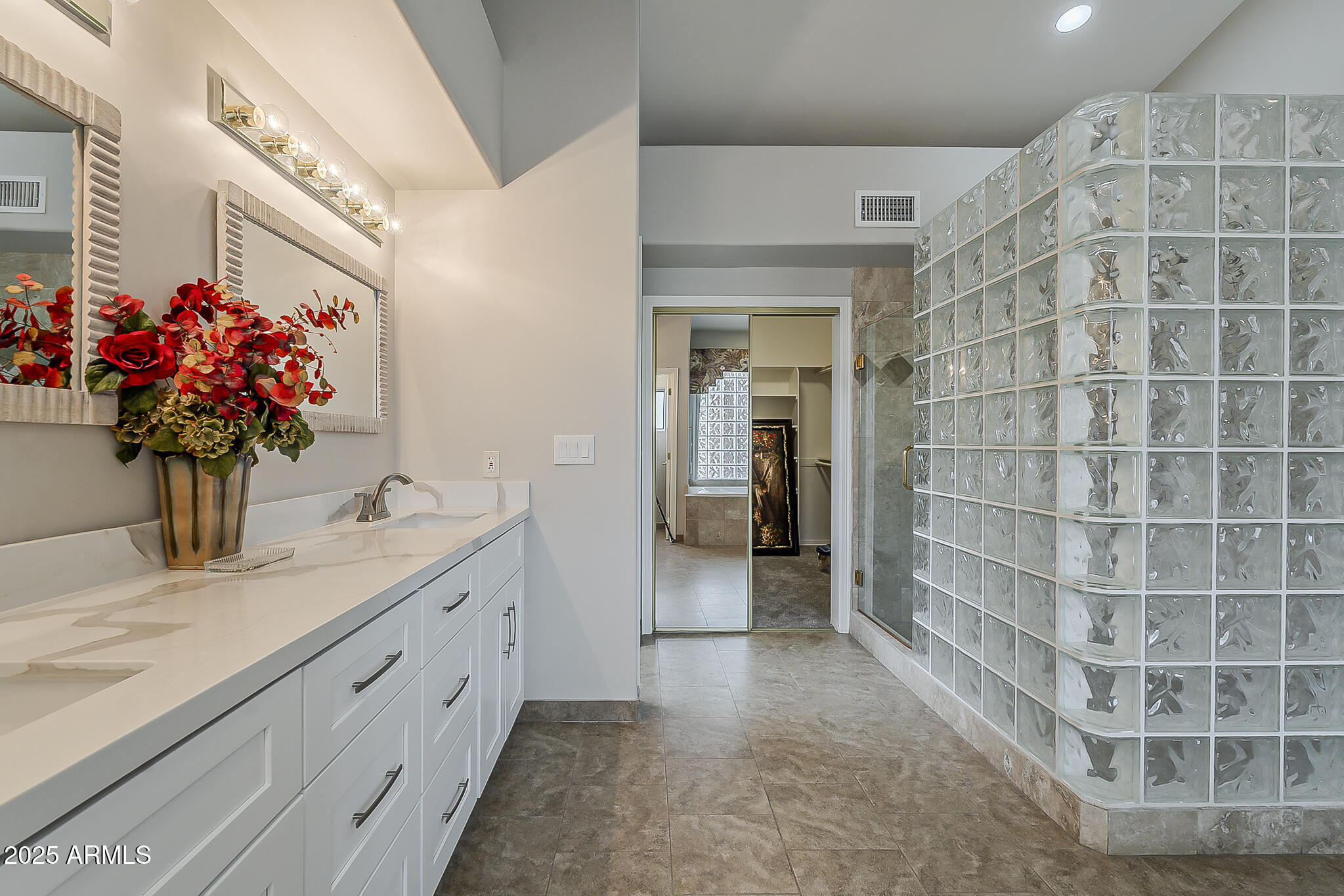 5345 East McLellan Road, Unit 112 Mesa, AZ 85205 - Photo 58 of 74 a bathroom with a sink and a mirror