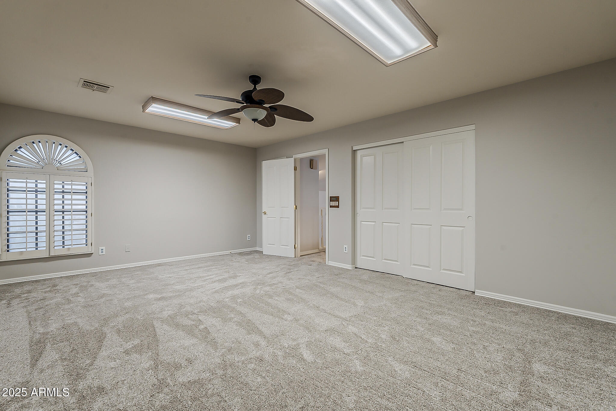 5345 East McLellan Road, Unit 112 Mesa, AZ 85205 - Photo 65 of 74 a view of an empty room with a window