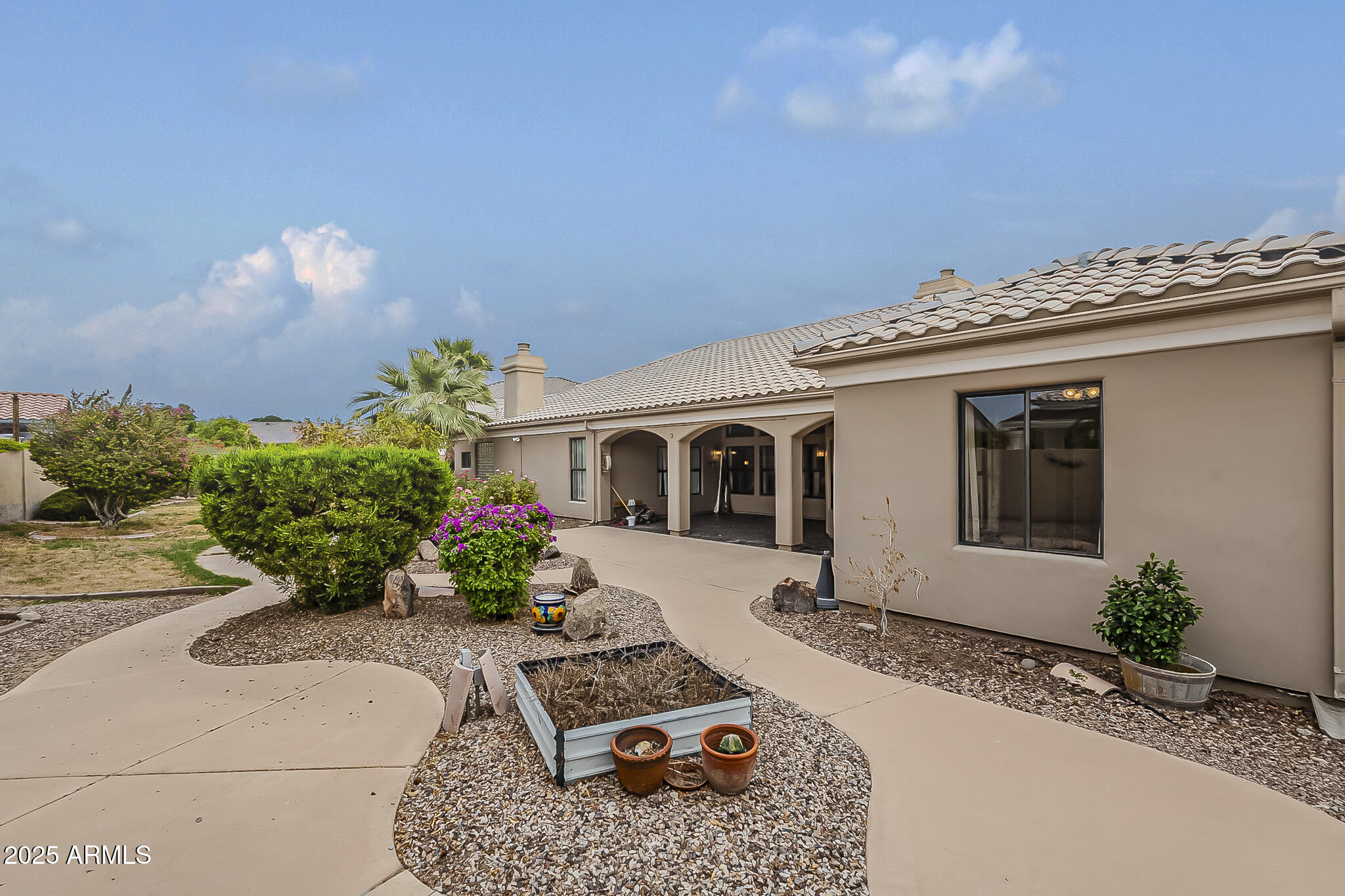 5345 East McLellan Road, Unit 112 Mesa, AZ 85205 - Photo 71 of 74 a front view of a house with garden