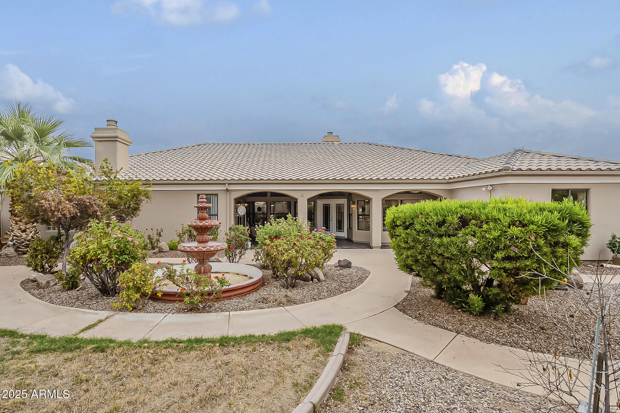 5345 East McLellan Road, Unit 112 Mesa, AZ 85205 - Photo 72 of 74 a front view of a house with garden