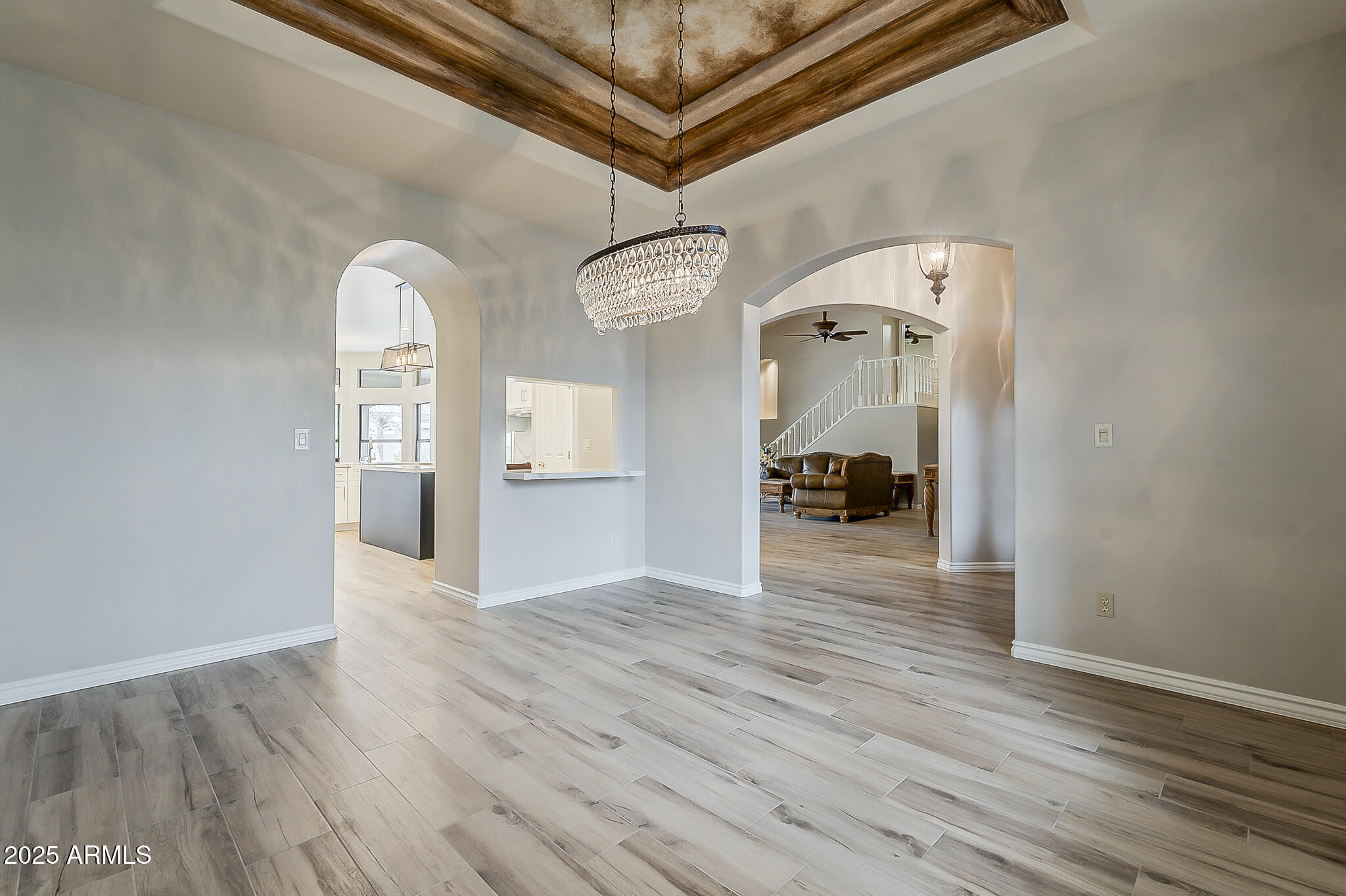 5345 East McLellan Road, Unit 112 Mesa, AZ 85205 - Photo 9 of 74 a view of a hallway with wooden floor and furniture