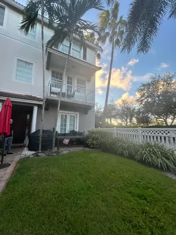 a view of a house with a yard porch and sitting area
