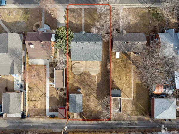 a aerial view of a houses with yard
