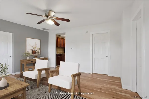 a view of a livingroom with furniture and wooden floor