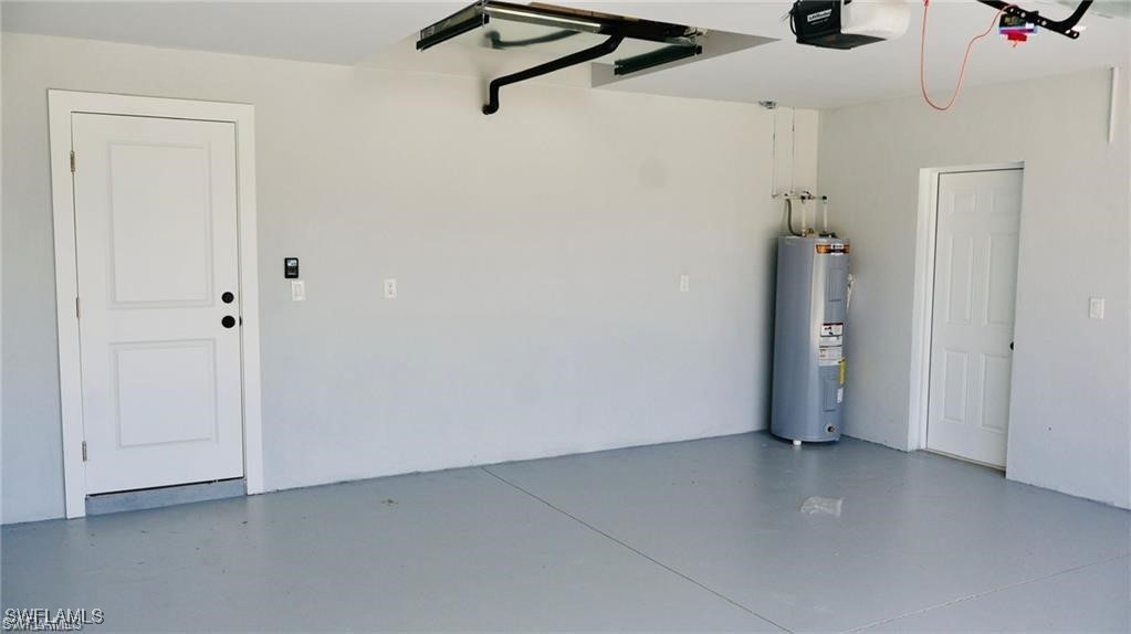417 Progress Avenue Lehigh Acres, FL 33974 - Photo 22 of 25 a view of a room with closet area