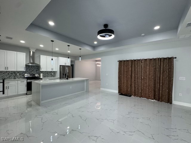 417 Progress Avenue Lehigh Acres, FL 33974 - Photo 4 of 25 a large kitchen with kitchen island a sink stainless steel appliances and cabinets