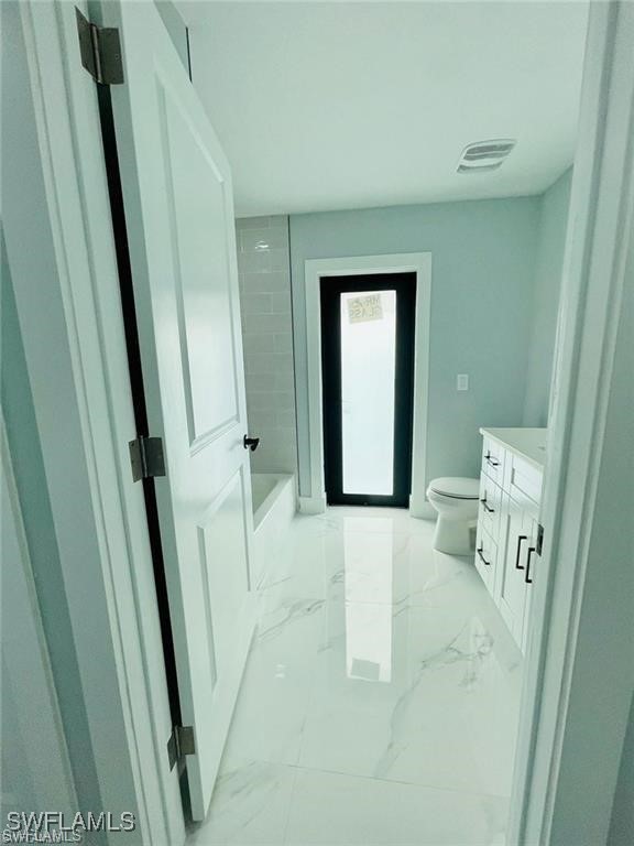 417 Progress Avenue Lehigh Acres, FL 33974 - Photo 6 of 25 a living room with furniture and a wooden floor