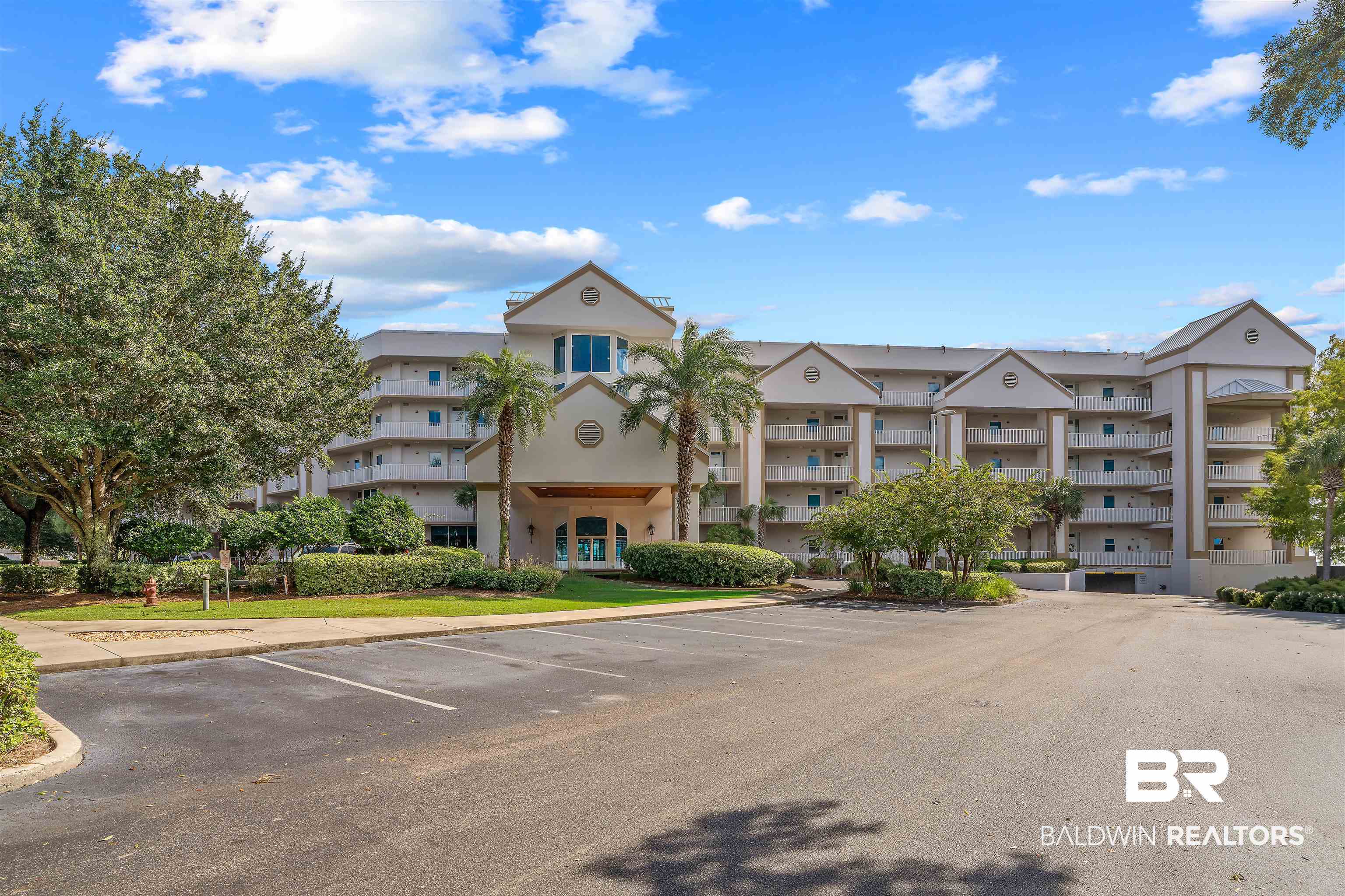 27800 Canal Road, Unit 113 Orange Beach, AL 36561 - Photo 2 of 35 View of apartment building / complex featuring uncovered parking