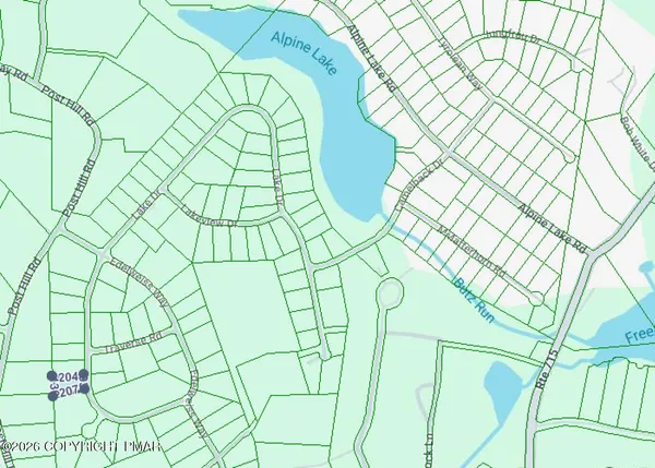 a bathroom with a shower curtain and a large window