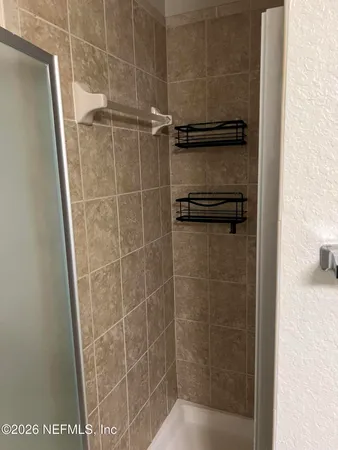 a view of a room with racks on the wall