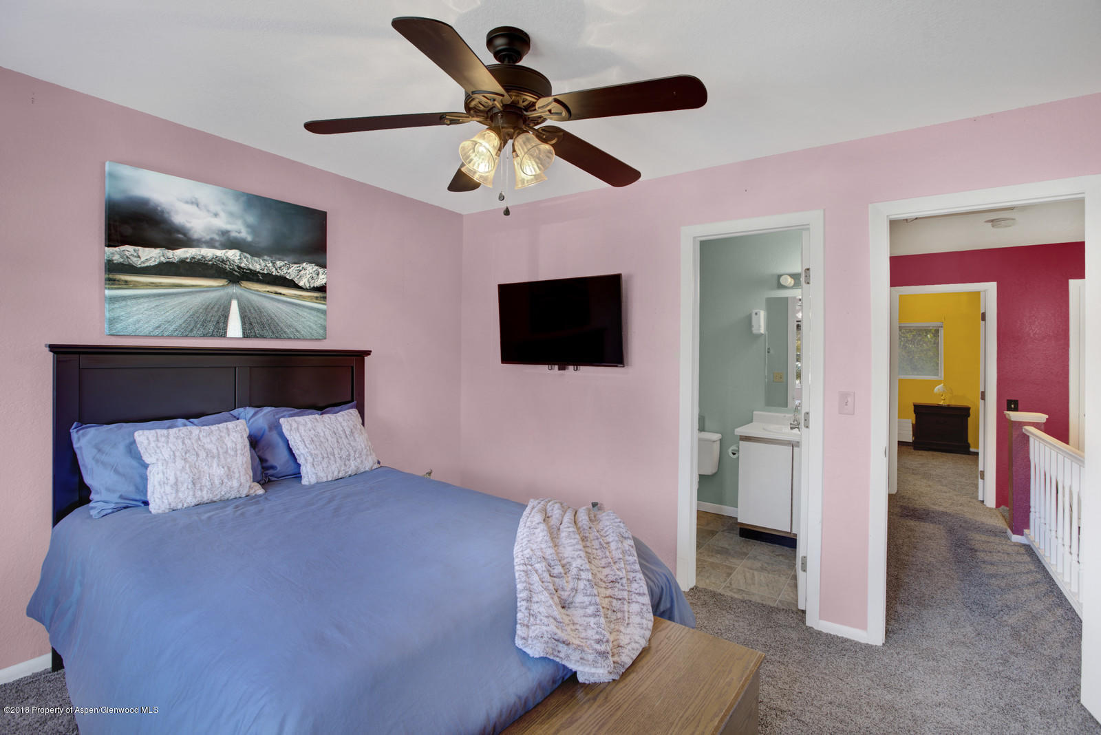 323 Park Avenue, Unit G2 Basalt, CO 81621 - Photo 13 of 16 a bedroom with a bed and a flat screen tv
