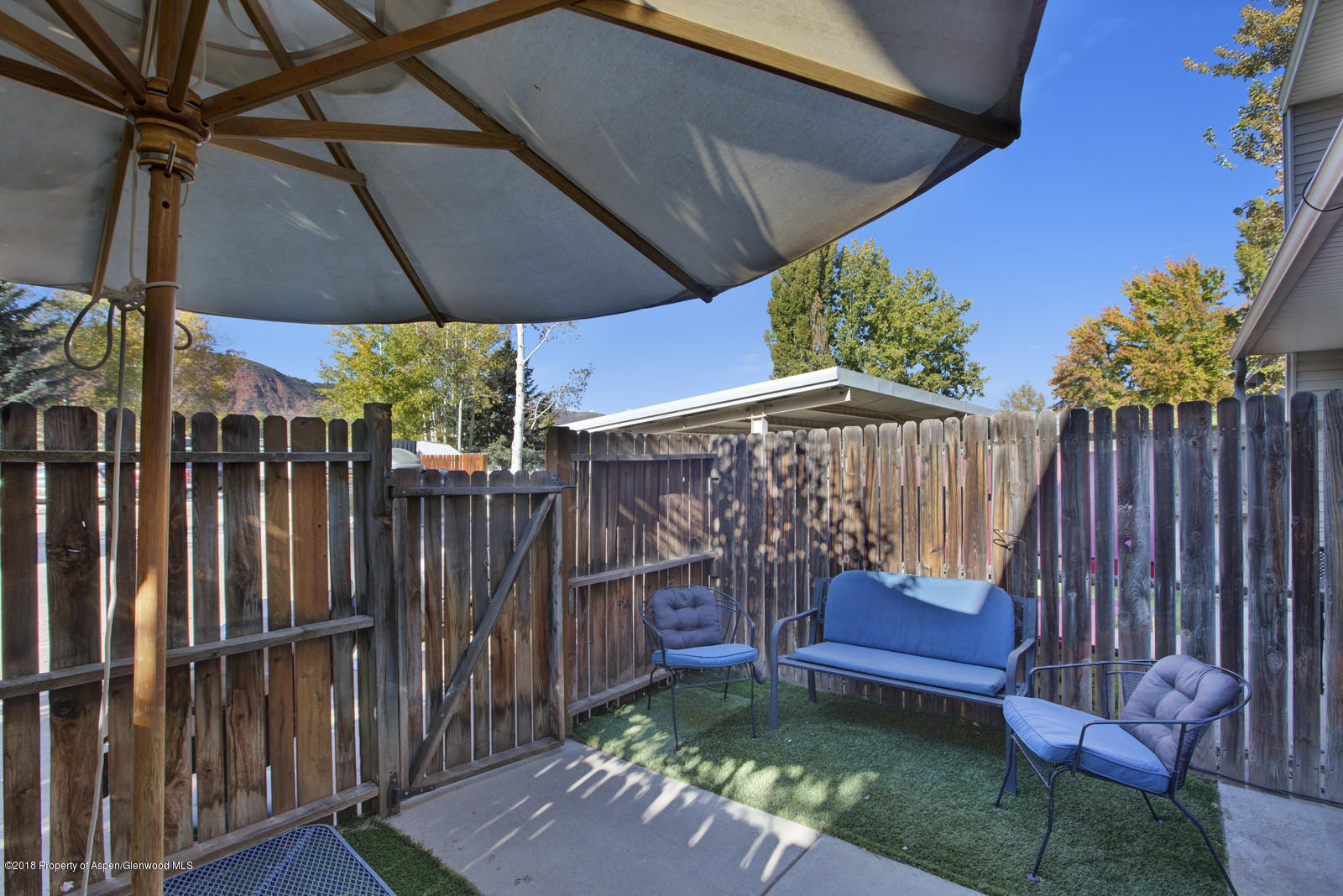 323 Park Avenue, Unit G2 Basalt, CO 81621 - Photo 16 of 16 a view of a deck with furniture and a yard