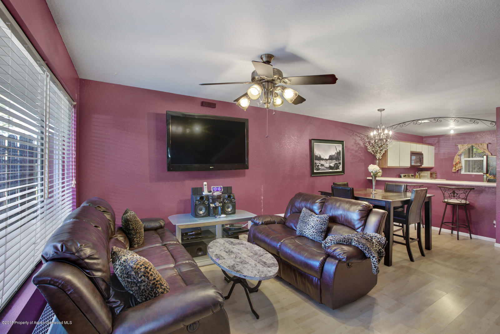 323 Park Avenue, Unit G2 Basalt, CO 81621 - Photo 3 of 16 a living room with furniture a flat screen tv and a window